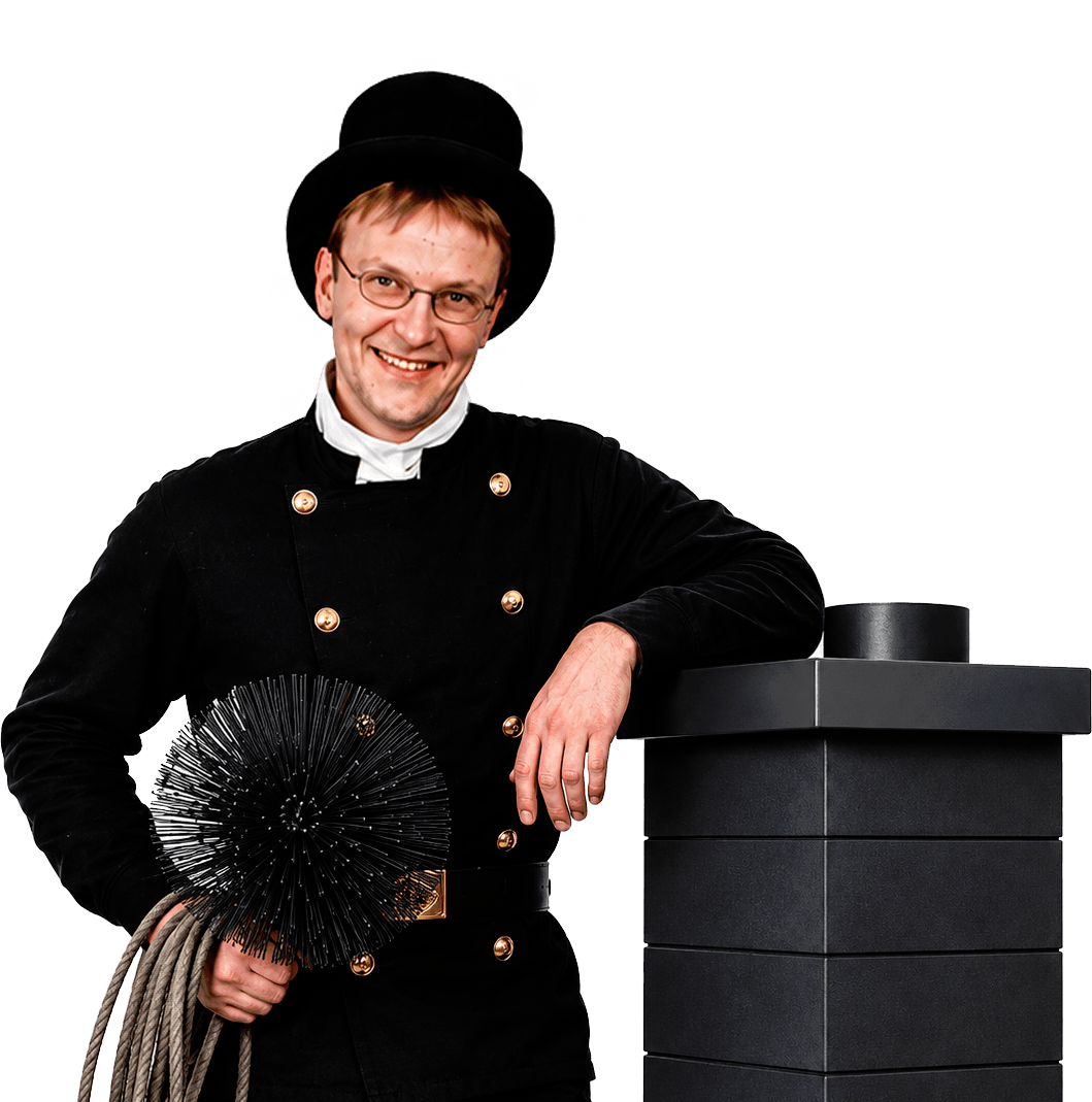Schornsteinfegermeister Hollmann am Schornstein